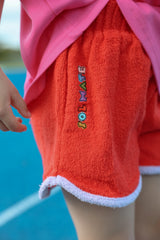 ESSENTIALS SHORT IN RED + LILAC