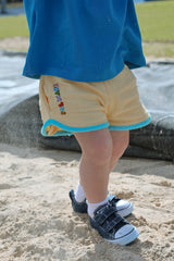 ESSENTIALS SHORT IN YELLOW + BLUE